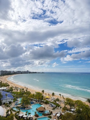 A resort with a pool area, beach, and ocean view. - Oceanview Studio 15th Floor - 2 Beds - Isla Verde (Carolina)