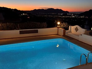 A swimming pool with a view of a cityscape at dusk. - Rendezvous by Interhome (Dénia)