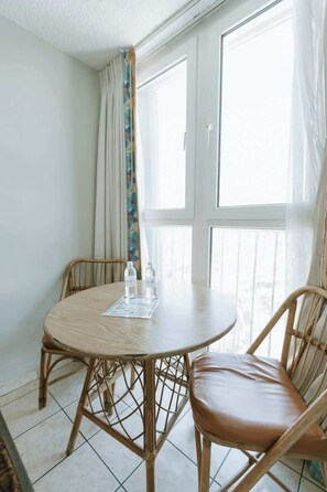 Dining - Balcony Studio • Ocean Breezes, AC• Prime Location (Carolina)