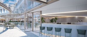 A modern interior with glass partitions, a bar area with stools, and a view through the glass. - Oikos Maragogi Resort - GAV Resorts (Maragogi)