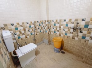 Deluxe Double Room | Bathroom | Shower, towels, soap, shampoo - Hotel Nandi Shree (Ujjain)