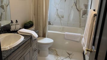 Shower, jetted bath, towels, soap