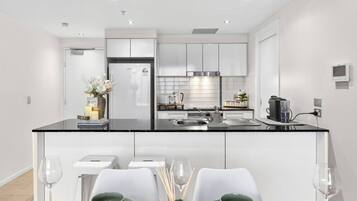 Coffee/tea maker, fridge, microwave, oven
