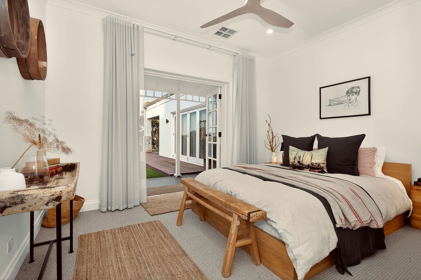 Several bedrooms with a warm coastal/rustic style