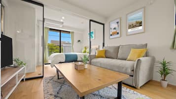 Apartamento standard, 1 cama de casal e sofá-cama, para não fumantes, de frente para a praia | Área de estar