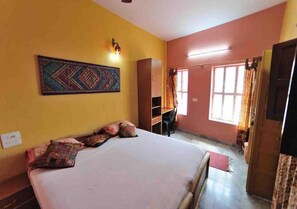 In-room safe, desk, laptop workspace - Ganpati Guest House (Varanasi)