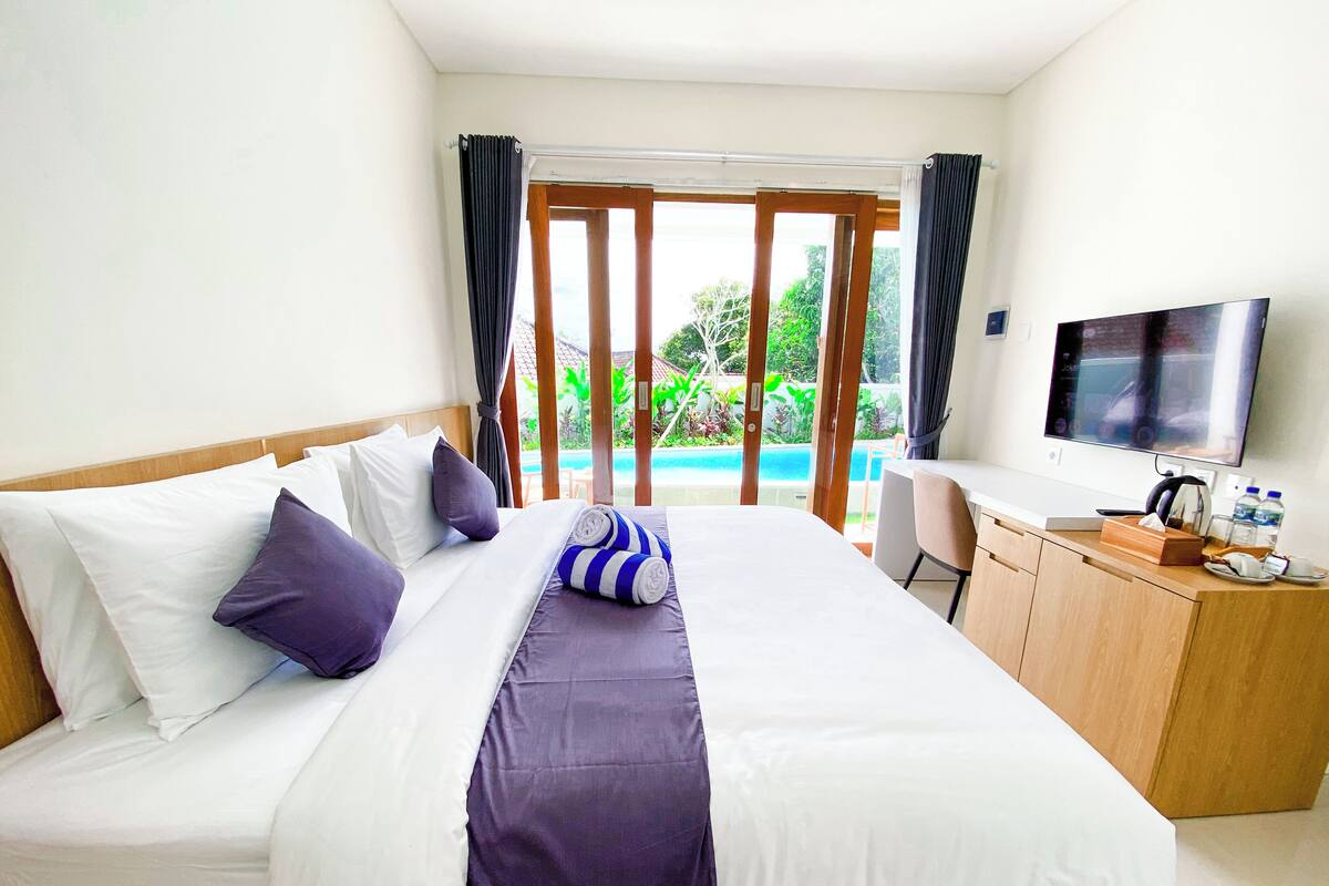 Deluxe Double Room, Pool View | Desk, laptop workspace, free WiFi
