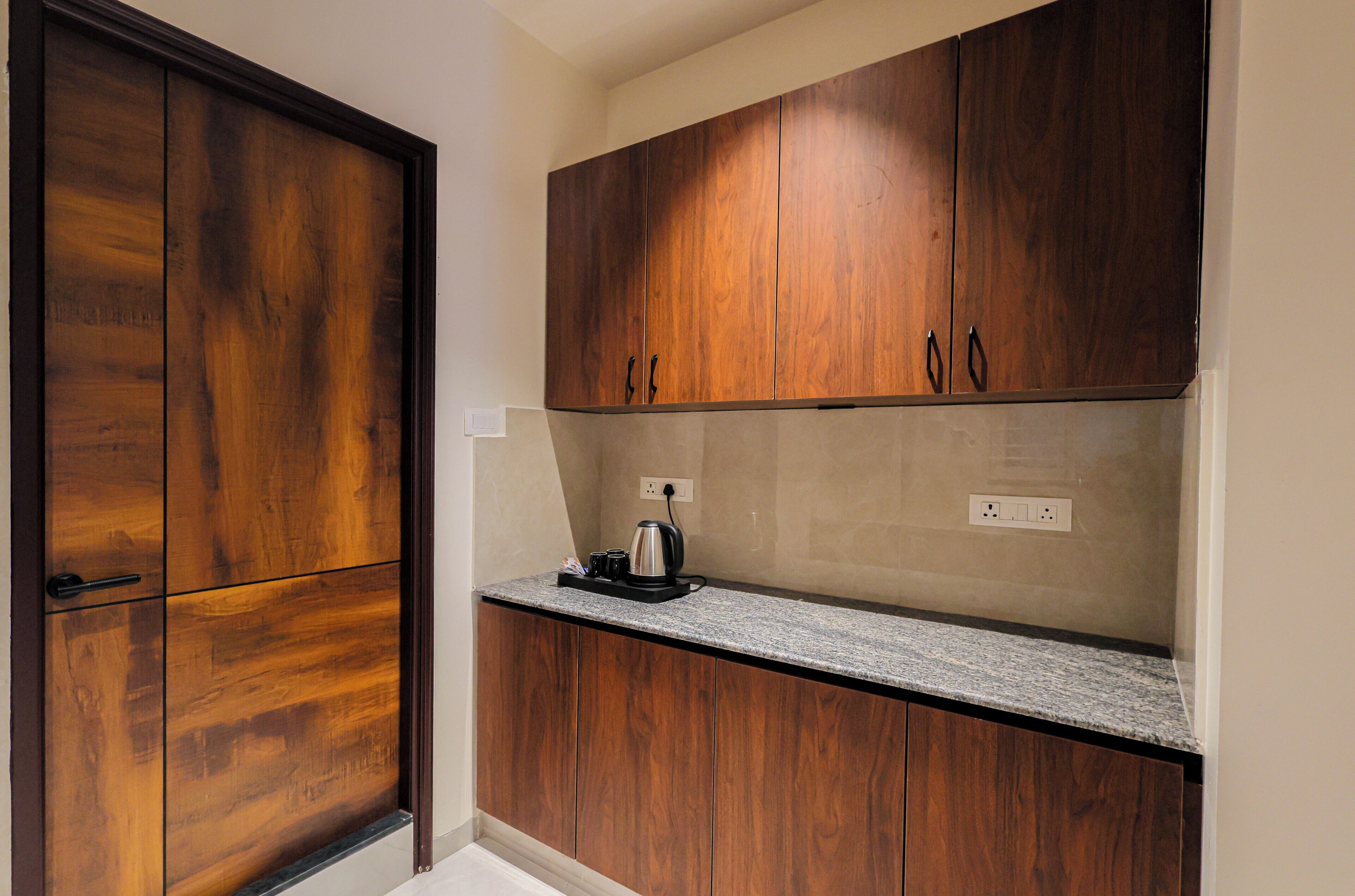 Family Triple Room | Private kitchen | Electric kettle, dining tables