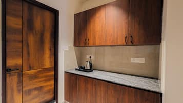 Family Triple Room | Private kitchen | Electric kettle, dining tables