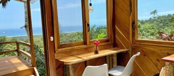 Hilltop cabin with incredible jungle and sea views