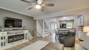 A modern living room with a fireplace, television, and seating area. - Swim Dock Access! Moneta Escape, 5 Mi to Boat Ramp (Moneta)