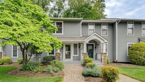 A two-story residential building with a front porch, a covered entryway, and a brick pathway leading to the door. - Swim Dock Access! Moneta Escape, 5 Mi to Boat Ramp (Moneta)