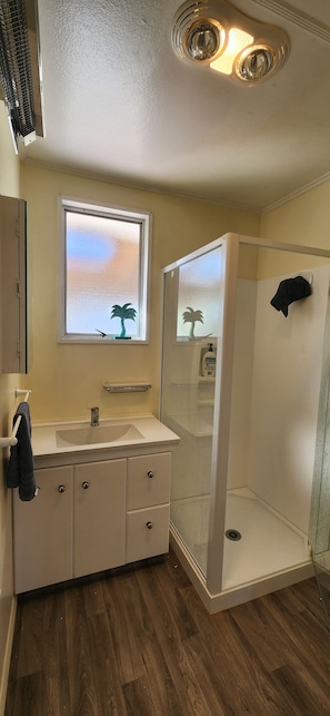 Shower, hair dryer, towels, soap