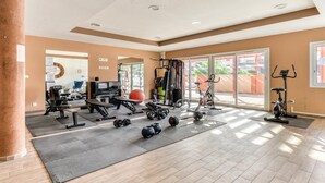 A gym with exercise equipment, a large window, and a pillar. - Chic 4-Guest Studio, Wellness & Pool (Argeles-sur-mer)