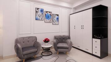 Chambre Double Deluxe, vue ville | Coin séjour