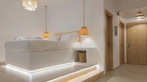 A modern bedroom with a built-in bed, bedside tables, and pendant lighting. - Casa Tu Zante ❤️- center & sea view (for 6 guests) (Zakynthos)