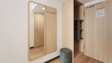 Hypo-allergenic bedding, desk, laptop workspace, blackout drapes