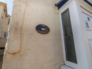 A building corner with a sign reading 'The Cottage.' - The Cottage (Budleigh Salterton)