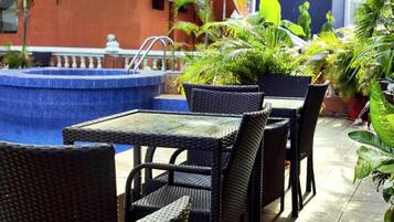 Deluxe Studio, Pool View | Outdoor dining