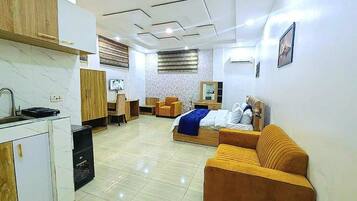Deluxe Studio, Pool View | Living area | Printers