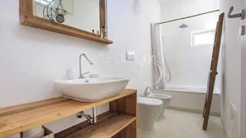 Shower, jetted tub, hair dryer, bidet