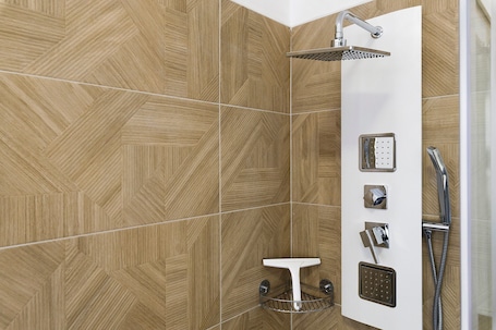 A shower area with a rain showerhead, handheld showerhead, and a handheld showerhead with a control panel.. Bed and Breakfast 'Villa Giusy' with Private Garden