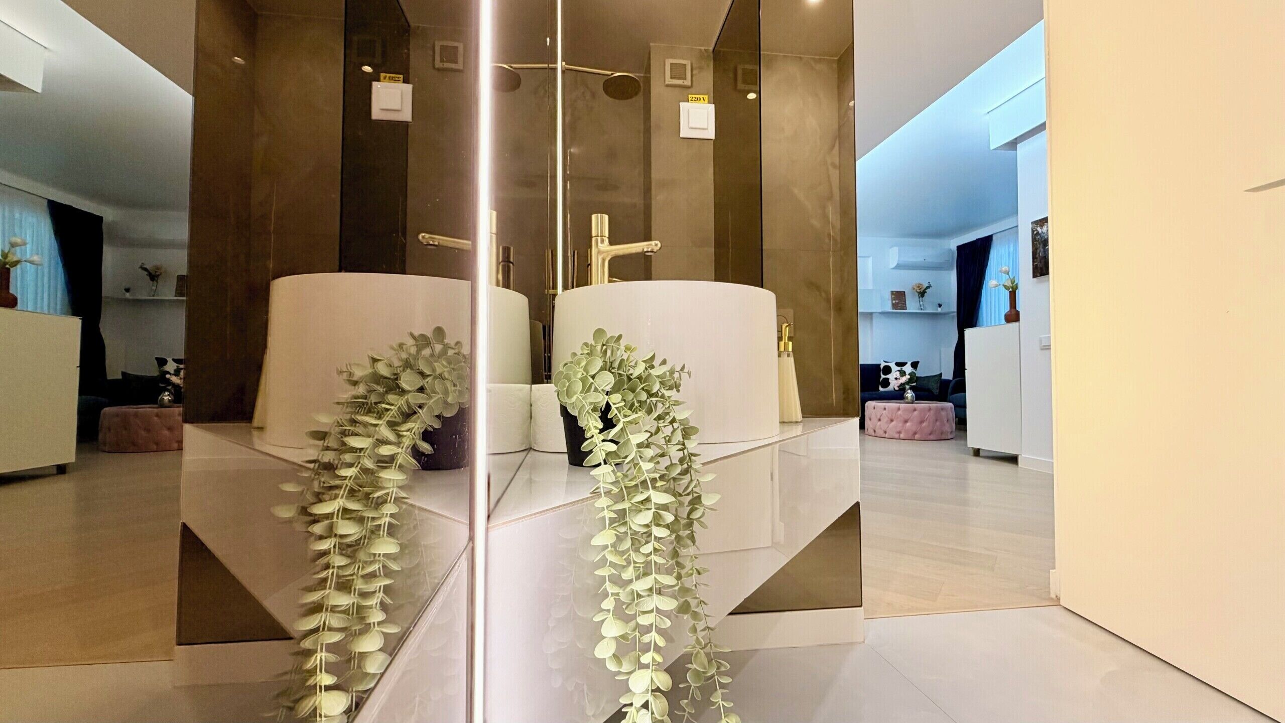 A modern bathroom with a glass partition, a shower area, and a toilet.