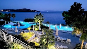 Seasonal outdoor pool, open 9:00 AM to 7:00 PM, pool umbrellas