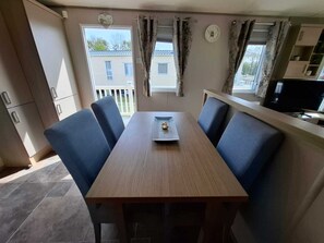 Dining - Unwind in our stunning premium waterside retreat. Full wraparound decking (Humberston)