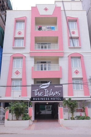 A multi-story building with a prominent sign for 'The Rihas Business Hotel' at the ground level. - The Itihas Business Hotel (Hyderabad)