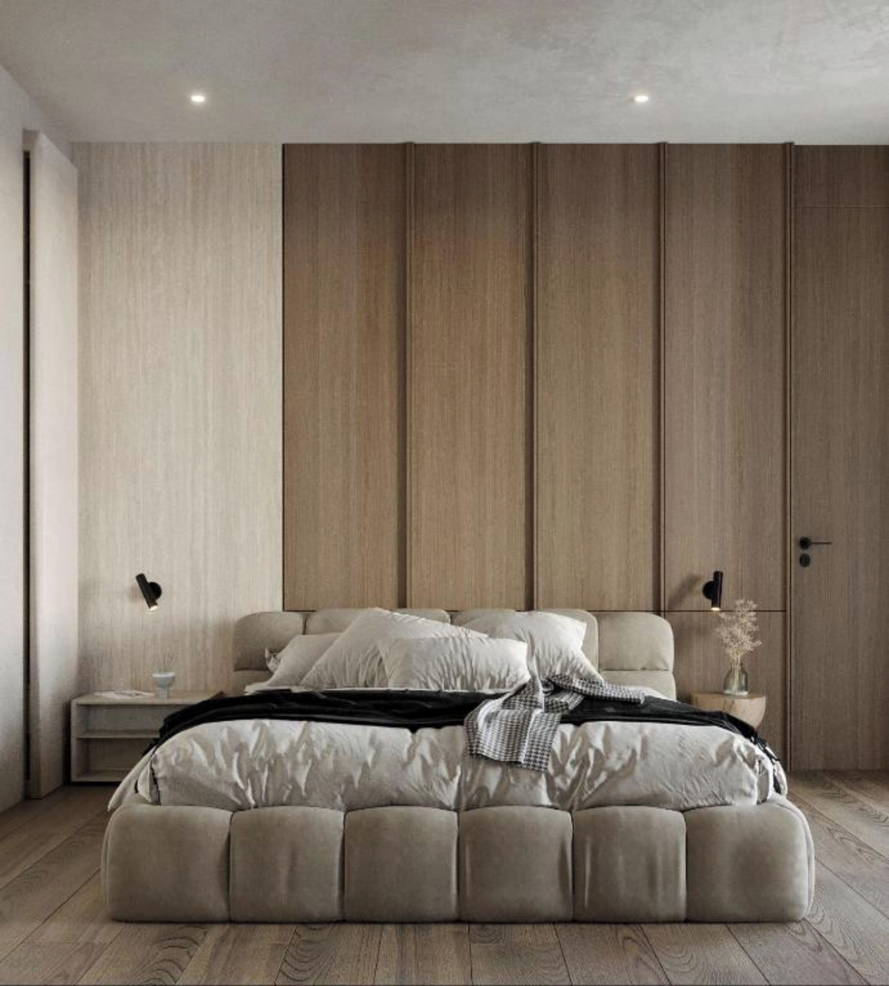 A modern bedroom with a large bed, a nightstand, and a wall unit.