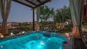 A hot tub with a view of a mountainous landscape, a pergola, and candles. - Altair Blue Villa - Private Jacuzzi and Views (Hersonissos)