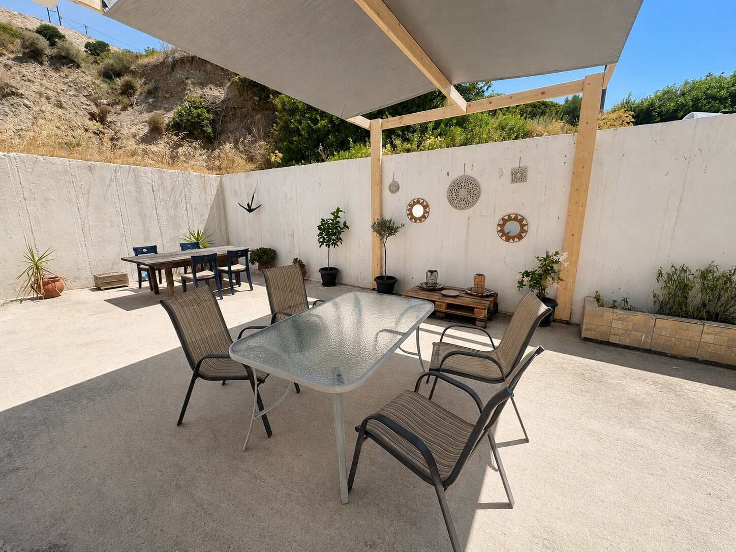 Spacious private patio with outdoor dining area and mountain views