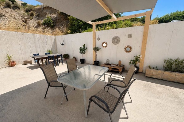 Spacious private patio with outdoor dining area and mountain views