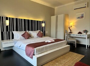 Executive Double Room, Pool View | Desk, laptop workspace, free WiFi - WaveCrest Morjim By Joy Stays (Morjim)
