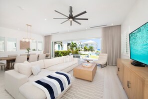 Smart TV - Oceans 9: Seaside Lazy River Pool, Sunken BBQ Ocean Lounge + Designer Interiors in West Bay (Grand Cayman)