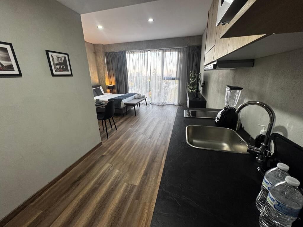 Departamento superior, vista a la ciudad | Tabla de planchar con plancha y wifi gratis 