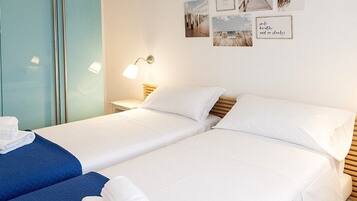 2 habitaciones, tabla de planchar con plancha, wifi y ropa de cama