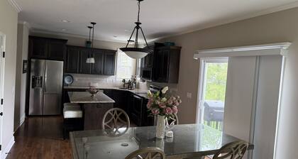 Spacious Home 13 miles from the stadium. 4 bedrooms 2.5 bathrooms 3 car garage.