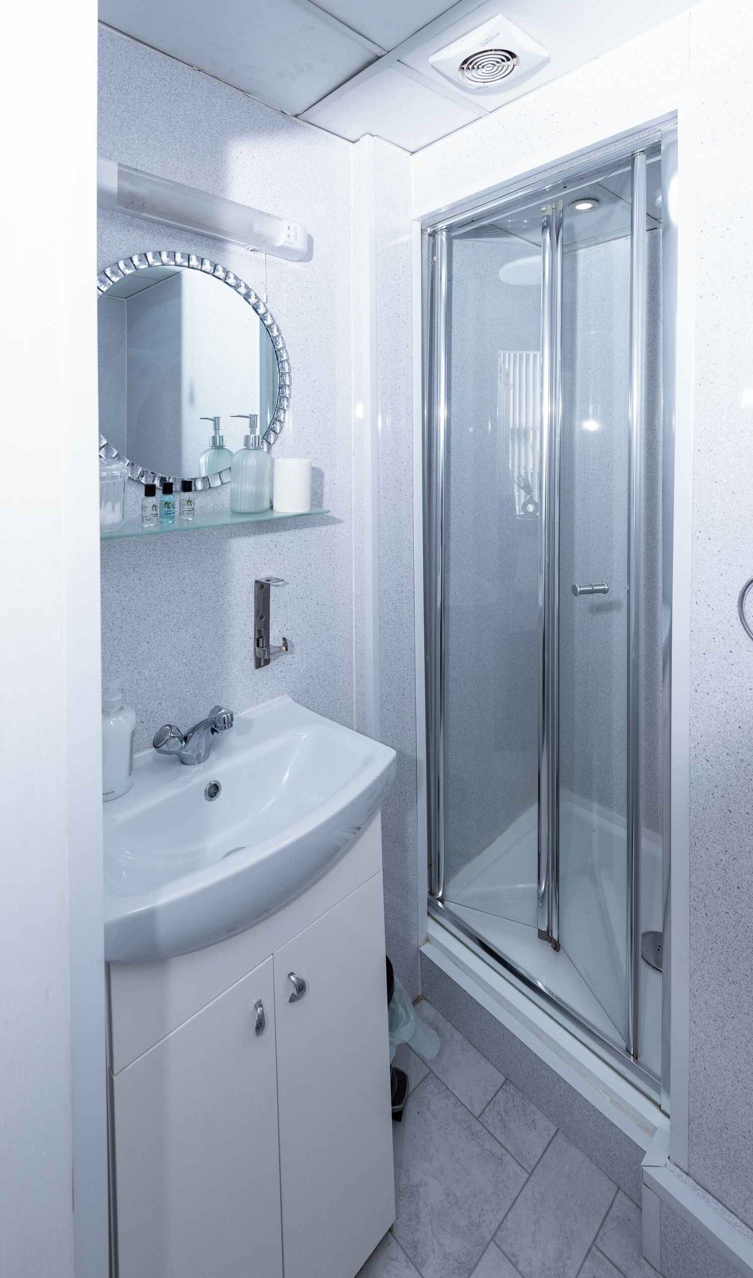 Shower, towels, toilet paper