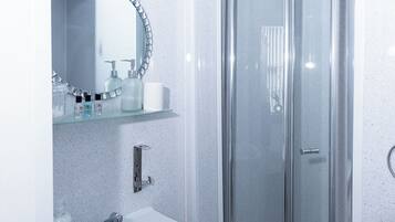 Shower, towels, toilet paper
