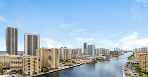 A waterfront cityscape with high-rise buildings, a marina, and a clear sky. - Modern Studio | Sunset Views | Beachwalk Resort (Hallandale Beach)