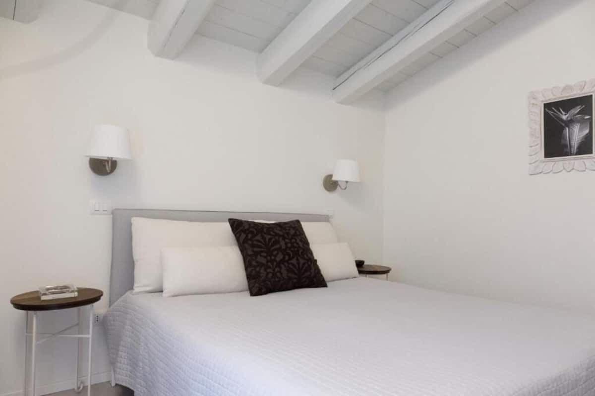 Family Suite, Patio, Garden View | In-room safe, desk, laptop workspace, soundproofing