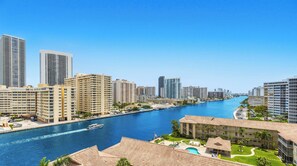 A high-rise hotel with a view of a river and city skyline. - Spectacular Sunsets · 2BR · Beachwalk Resort (Hallandale Beach)
