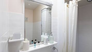 Shower, towels, toilet paper