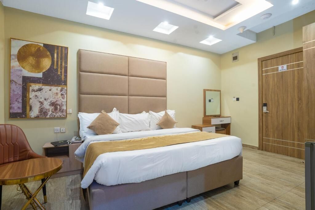 Deluxe Apartment, Balcony, City View | In-room safe, desk, laptop workspace, blackout drapes