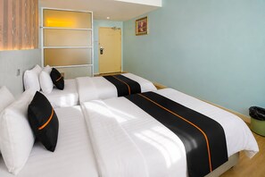 A hotel room with two beds, a wardrobe, a door, and a trash bin. - Collection O Near Tanjung Batu Formerly 4orty Inn (Bintulu)