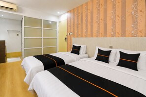 A hotel room with two beds, a sliding door, and a patterned wall. - Collection O Near Tanjung Batu Formerly 4orty Inn (Bintulu)