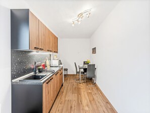 Fridge, microwave, cookware/dishes/utensils