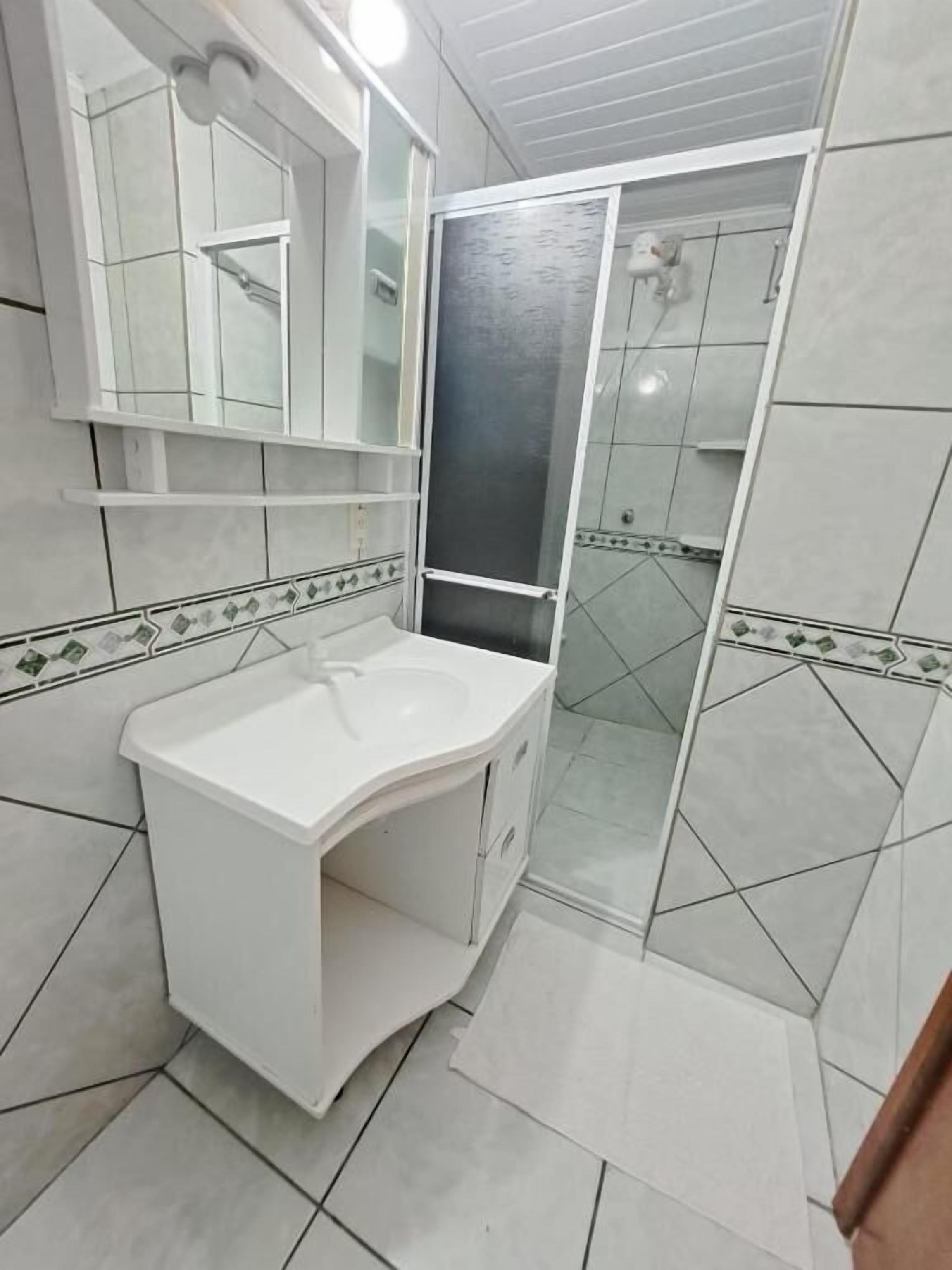 Combined shower/tub, hair dryer, towels, toilet paper